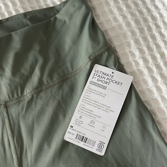 NWT Athleta Ultimate Stash Pocket 7&quot; Short in Laurel Olive Green Size M $60