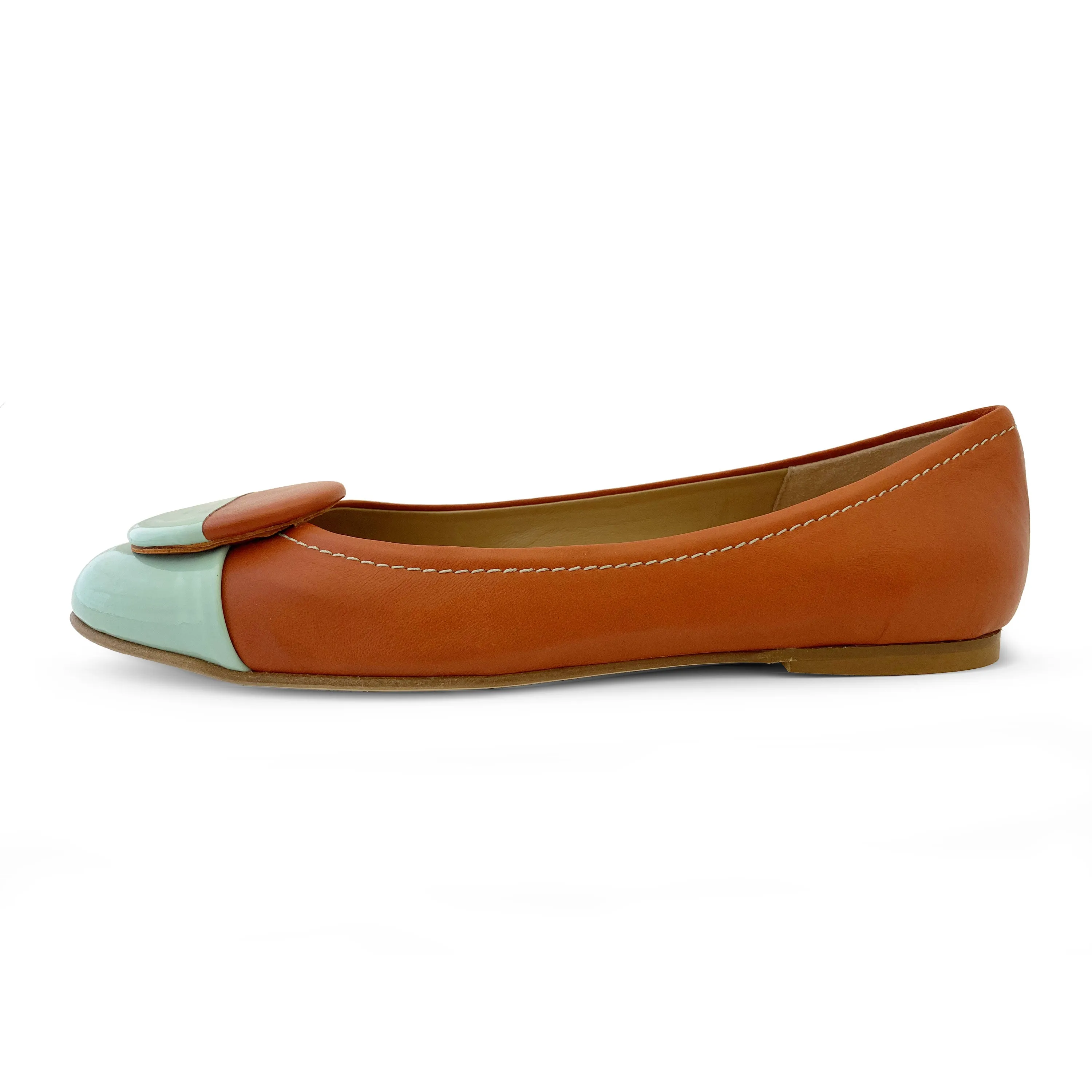 Tan leather ballet flats with green patent leather toe and stud